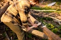 Bearded lumberjack chopping trees with ax. Brutal bearded lumberjack with ax in forest Royalty Free Stock Photo