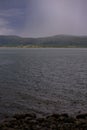 Strong summer storm. Water bubbles formed on the surface of the lake due to heavy rain Royalty Free Stock Photo