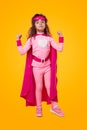 Strong superhero kid in pink outfit Royalty Free Stock Photo