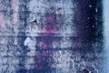 Strong surface structure with rest of blue and violet paint on concrete wall for abstract backgrounds. Royalty Free Stock Photo