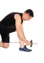 Exercising man tying his shoe laces Royalty Free Stock Photo