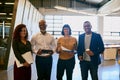 Strong teams are the foundation of high-performing business. Portrait of a group of designers posing together in their Royalty Free Stock Photo