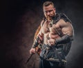 Severe barbarian in warrior clothes