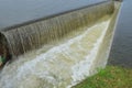 Strong waterfall from side channel spillway