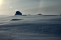 Strong wind on snowy slope of mountain. Drifting snow