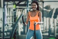 Strong woman exercising with battle ropes during functional training Royalty Free Stock Photo