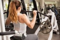Strong woman on a lat pulldown machine
