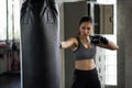 Strong woman practice Thai boxing in gym Royalty Free Stock Photo