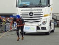 Strong woman pulling a heavy truck Royalty Free Stock Photo