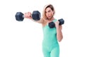 Strong woman punching with barbells in hands during boxing class on white background. One girl working out in studio Royalty Free Stock Photo