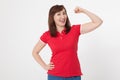 Strong woman showing her muscularity and looking at camera isolated on white. Copy space and blank shirt. Mother day