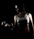 Strong woman working out with heavy weights