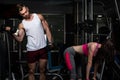 Young Couple Doing Exercise For Biceps With Dumbbells Royalty Free Stock Photo