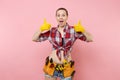 Happy handyman woman in shirt, denim shorts, yellow gloves, kit tools belt full of variety useful instruments showing