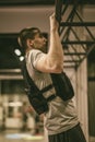 Young man doing pull ups in the gym Royalty Free Stock Photo