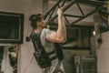 Young man doing pull ups in the gym Royalty Free Stock Photo