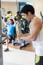 Strong young man exercising triceps pushdown at the rope cable machine Royalty Free Stock Photo