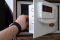 strongbox safe with buttons in a hotel room on a shelf Royalty Free Stock Photo