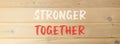 Stronger together symbol. Concept words Stronger together on beautiful wooden wall. Beautiful wooden wall background. Business, Royalty Free Stock Photo