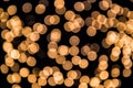 Strongly blurred lights garlands. Yellow ball. Christmas background Royalty Free Stock Photo