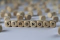 Strongly - cube with letters, sign with wooden cubes