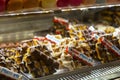 Stroopwafel with chocolate, typical Dutch sweet snacks on a cafe display in Amsterdam