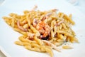 Strozzapreti pasta dish with prawns and squid