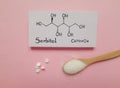 Structural chemical formula of sorbitol with white tablets and artificial sweetener in wooden spoon. Royalty Free Stock Photo