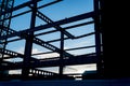 Structural steel girders framed in silhouette.