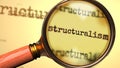 Structuralism and a magnifying glass on English word Structuralism to symbolize studying, examining or searching for an