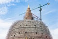 Structure of big pagoda stupa under construction with crane