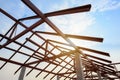 Structure of steel roof frame for building construction on sky b Royalty Free Stock Photo