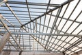 Structure of steel roof frame for home construction. Concept of residential building under construction Royalty Free Stock Photo