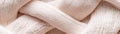 Structured knitted fabric features a geometric design in beige, enhanced by ultra-sharp lighting that creates depth and