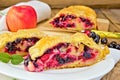 Strudel with black currants and apples on board Royalty Free Stock Photo