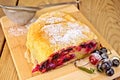 Strudel with black currants on board