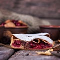 Strudel with a cherry. Cherry pie. Royalty Free Stock Photo