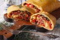 Strudel with ham, cheese and vegetables closeup. horizontal