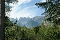 Strudelkopf - Panoramic view on the high Italian Dolomites peaks. There are dense pine trees in the front, distant mountain peaks Royalty Free Stock Photo