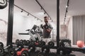 Struggling with age. Confident senior man exercising with dumbbells in health club. Selective focus Royalty Free Stock Photo