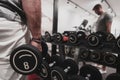 Struggling with age. Confident senior man exercising with dumbbells in health club. Selective focus Royalty Free Stock Photo