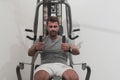 Struggling with age. Confident senior man exercising in health club. Selective focus Royalty Free Stock Photo