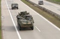 Stryker,wheeled armored vehicle drives on highway . Royalty Free Stock Photo