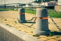 Stub posts linked in a chain on a quay