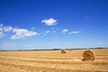 Stubble field and hay bales Royalty Free Stock Photo