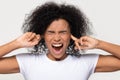 Stubborn angry black woman sticking plug fingers in ears Royalty Free Stock Photo