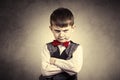 Stubborn,sad,upset little boy,child over grey backgro Royalty Free Stock Photo