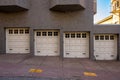 Stucco Building With Four Garage Doors Going Down Hill Royalty Free Stock Photo