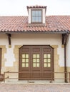 Stucco building with tile roof and window Royalty Free Stock Photo