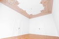 Stucco decoration ceiling in empty apartment room in old flat with parquet floor Royalty Free Stock Photo